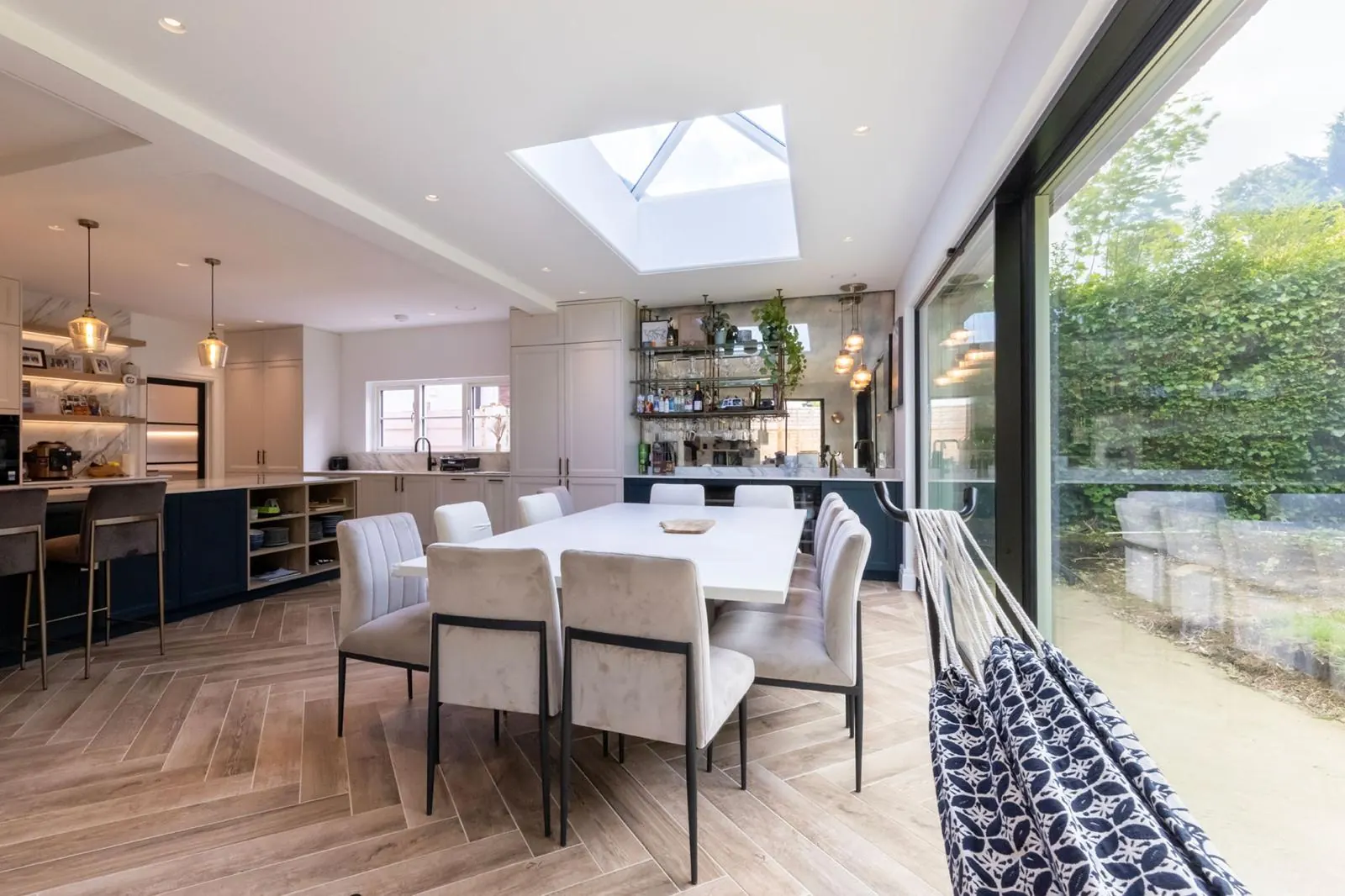 Dining area with sliding doors opening to the garden, Hertfordshire