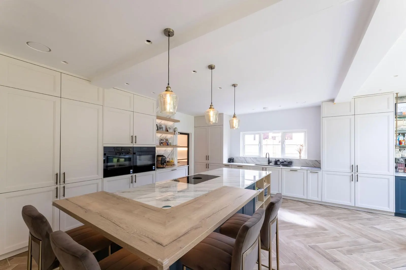 Open-plan kitchen with island and pendant lighting, Hertfordshire