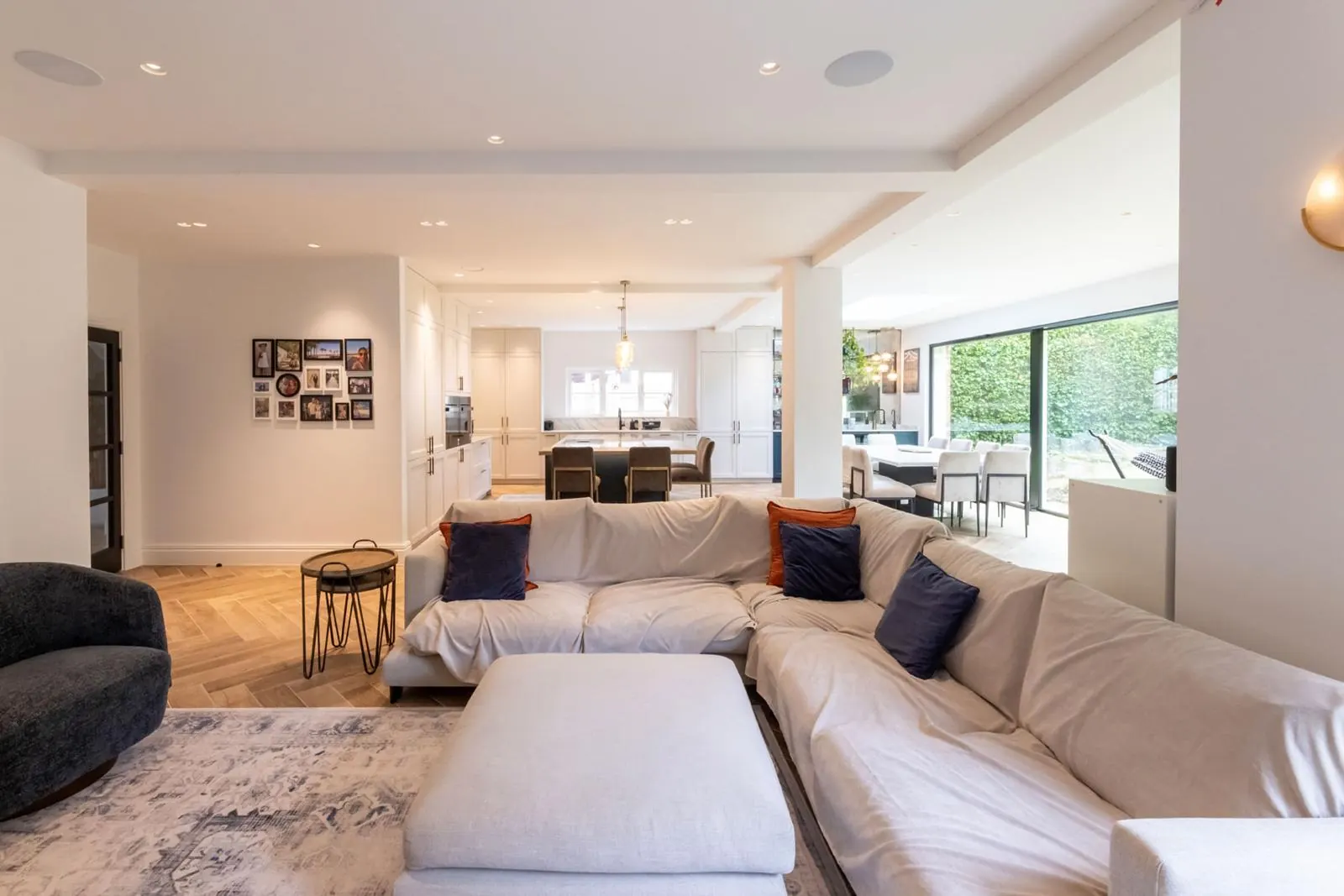 Open living room with statement pendant lighting, Hertfordshire