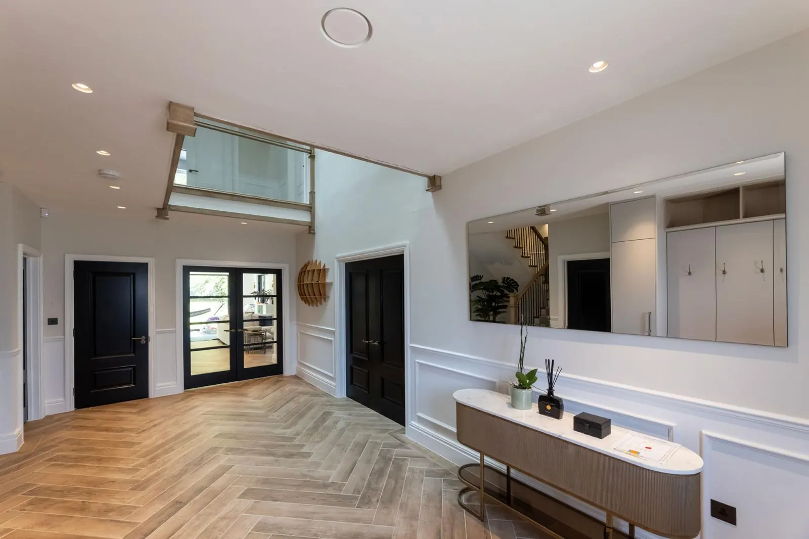 Open-plan living space with breakfast bar and integrated joinery, Hertfordshire